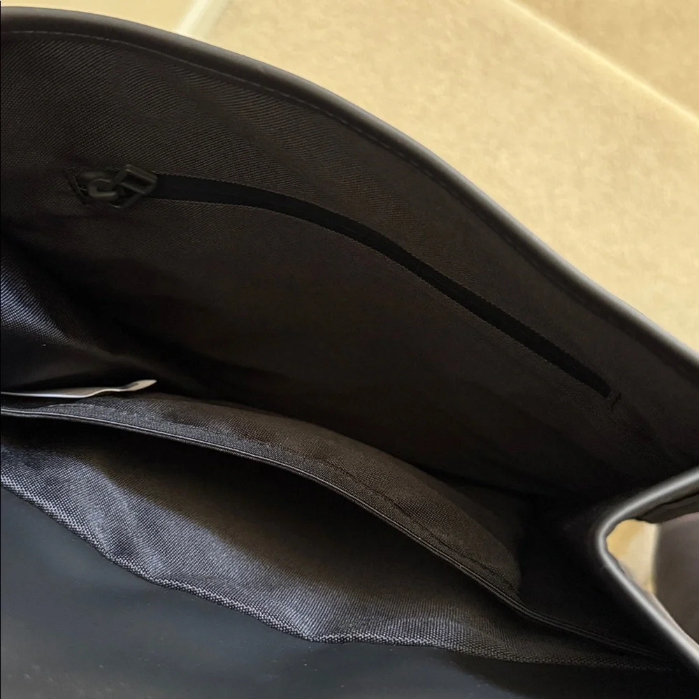 Rains Black Backpack. Clean and ever contemporary.